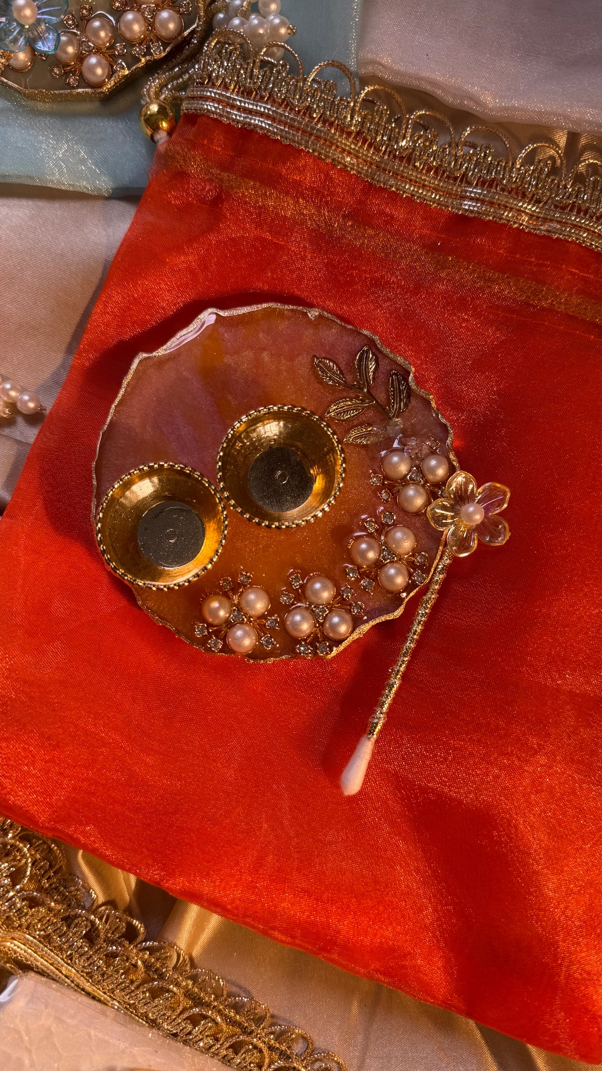 Mini thali+teeka applicator set in a potli