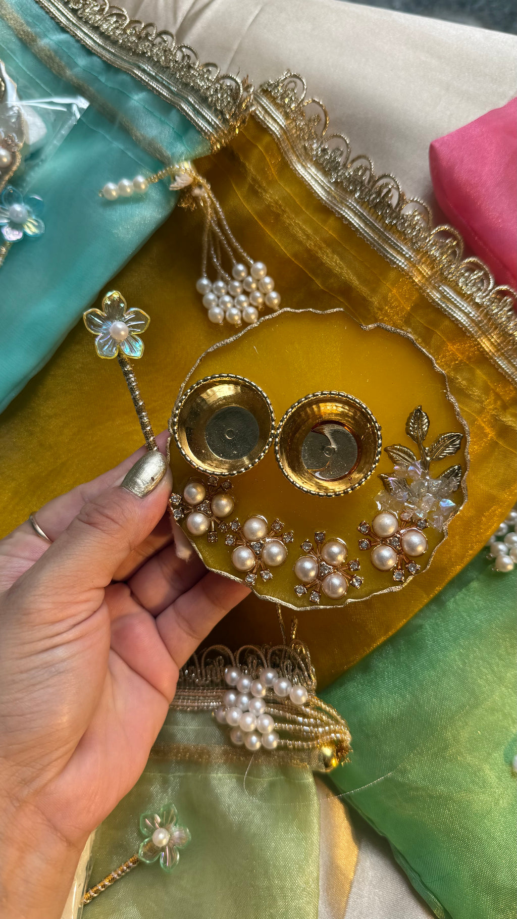Mini thali+teeka applicator set in a potli