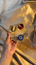 Evil eye roli plate in 4 inches